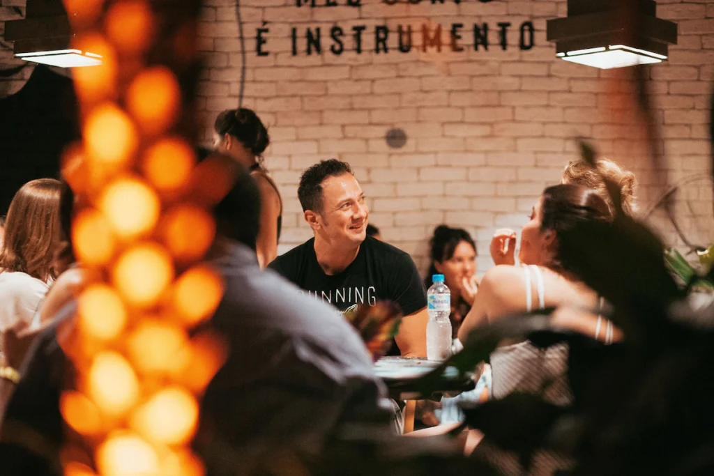Guests enjoying a chef-hosted pop-up dinner at Culinary Lab Copacabana